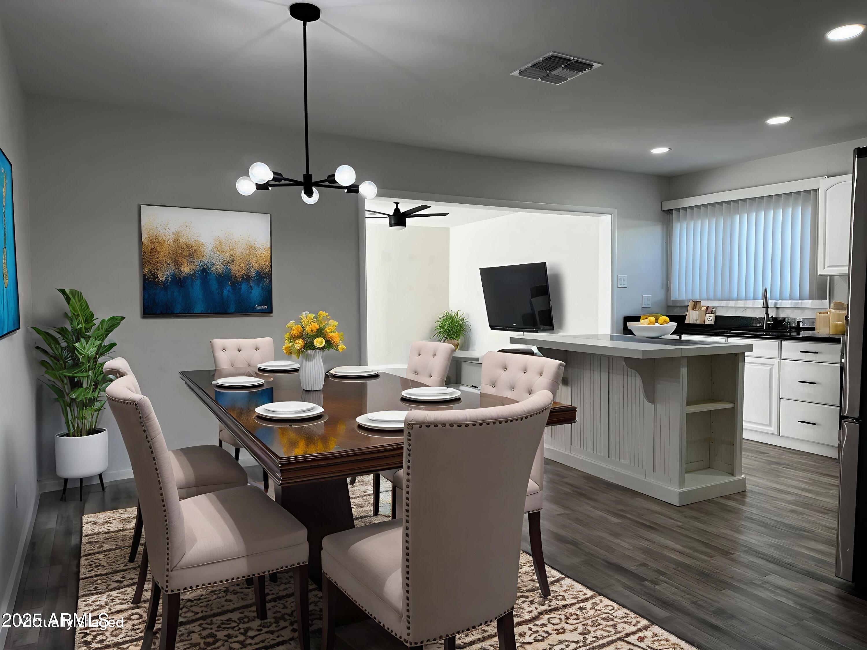 6818 South Terrace Road Tempe, AZ 85283 - Photo 4 of 11 a view of a dining room with furniture window and wooden floor