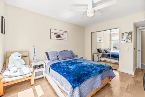 a spacious bedroom with a bed and a couch