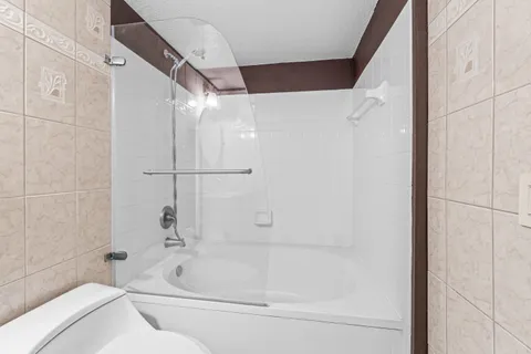 a bathroom with a bathtub and a shower