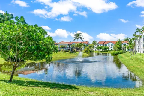 a view of a lake with houses in the background