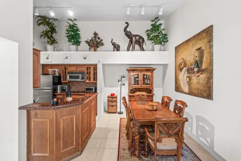 a dining room with furniture and window