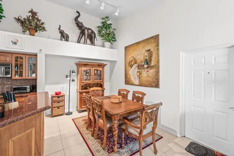 a dining room with a furniture and wooden floor