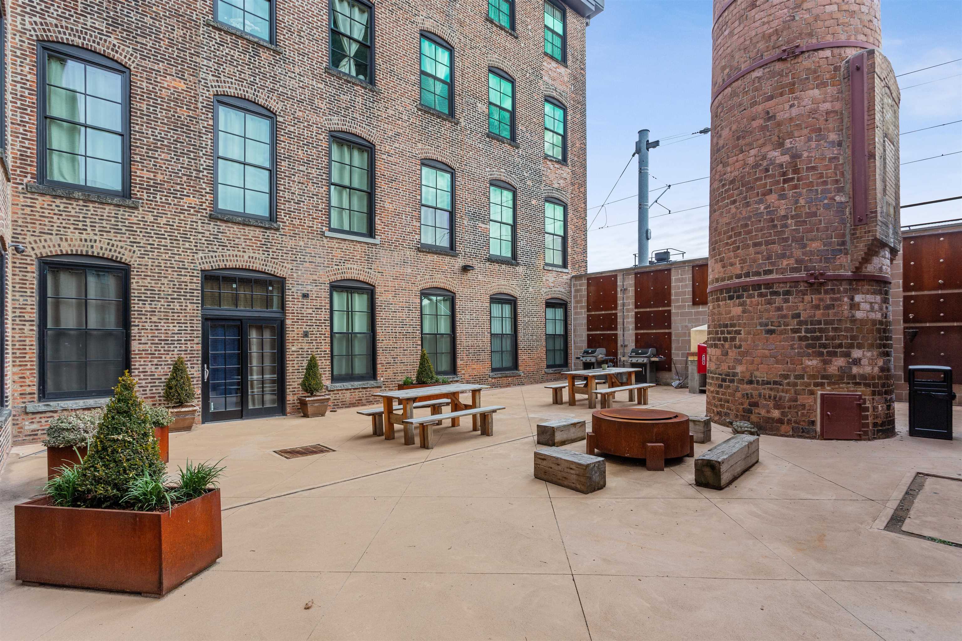 154 Ave East, Unit A501 Bayonne, NJ 07002 - Photo 14 of 19 a view of a building with sitting area