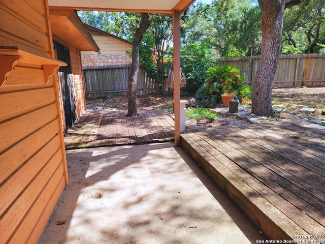 a view of a backyard with a patio