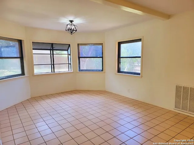a view of an empty room and window