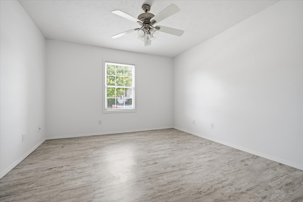 915 Teegan Street Normal, IL 61761 - Photo 19 of 33 wooden floor in an empty room with a window