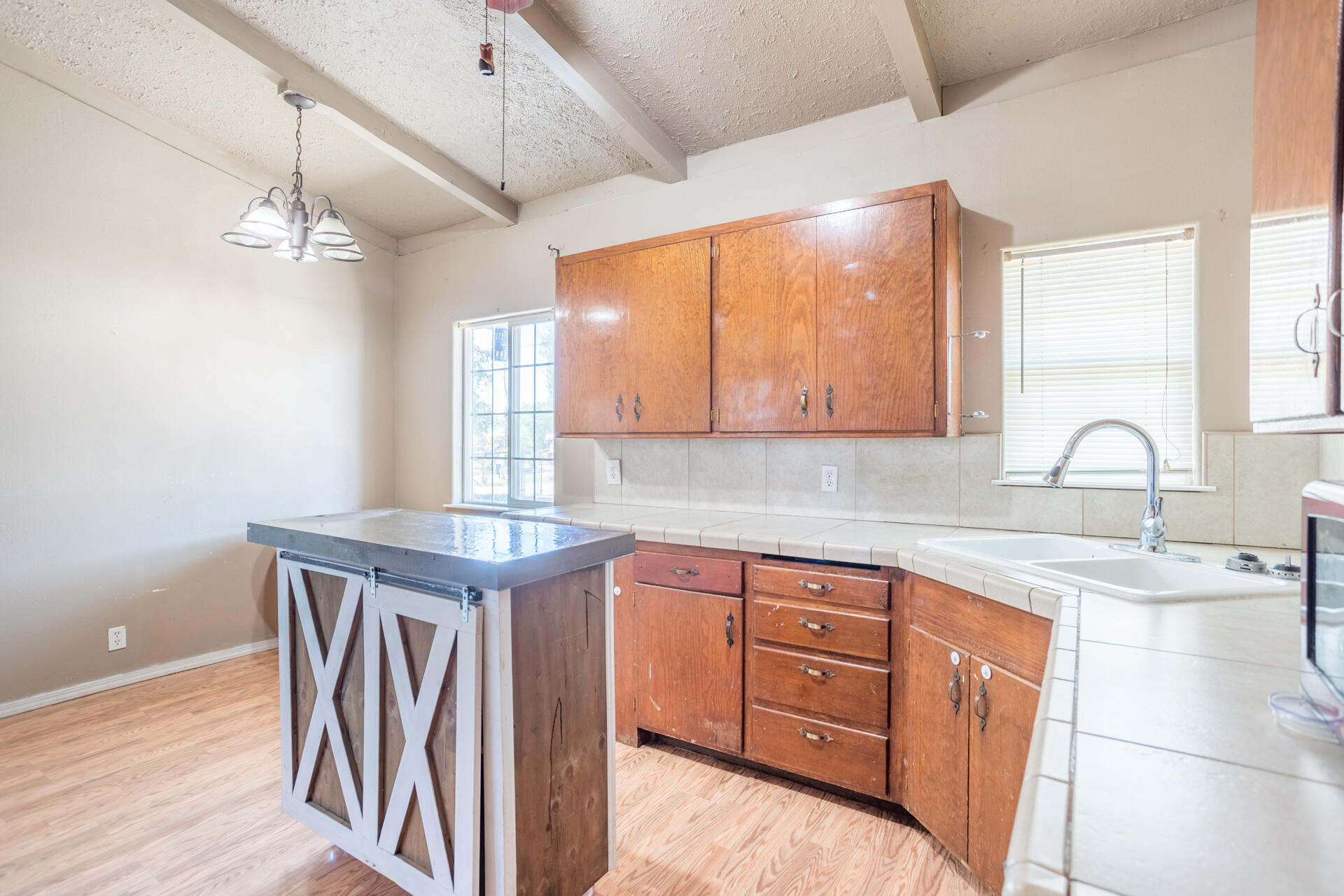 12141 Cinder Road Redding, CA 96003 - Photo 12 of 23 a kitchen with stainless steel appliances granite countertop a sink a stove and a wooden floors
