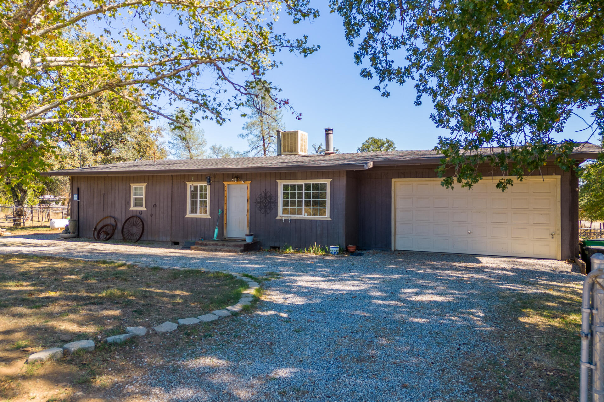 12141 Cinder Road Redding, CA 96003 - Photo 15 of 23 front view of a house with a yard