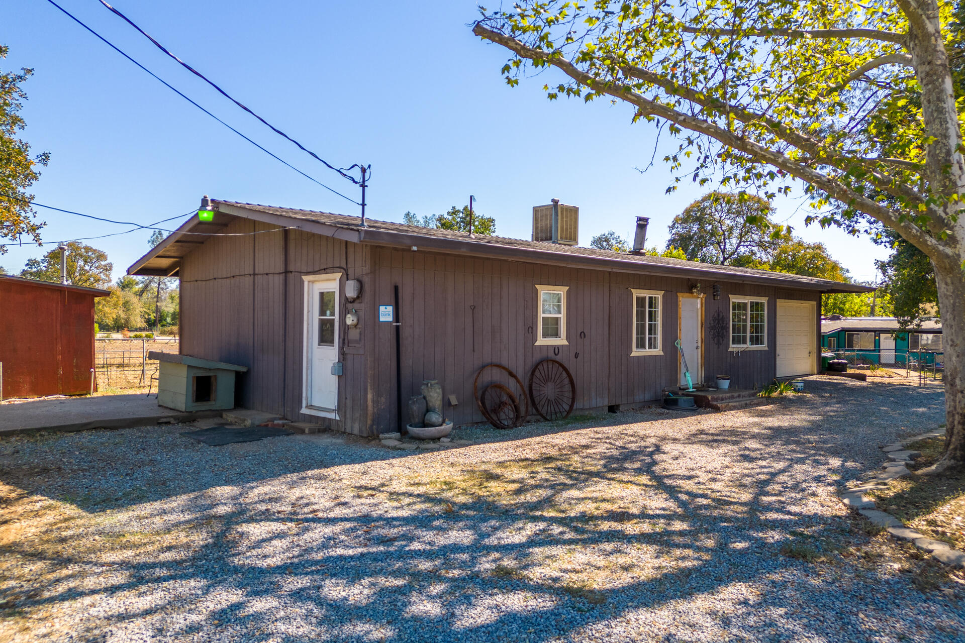 12141 Cinder Road Redding, CA 96003 - Photo 17 of 23 a front view of a house with a yard