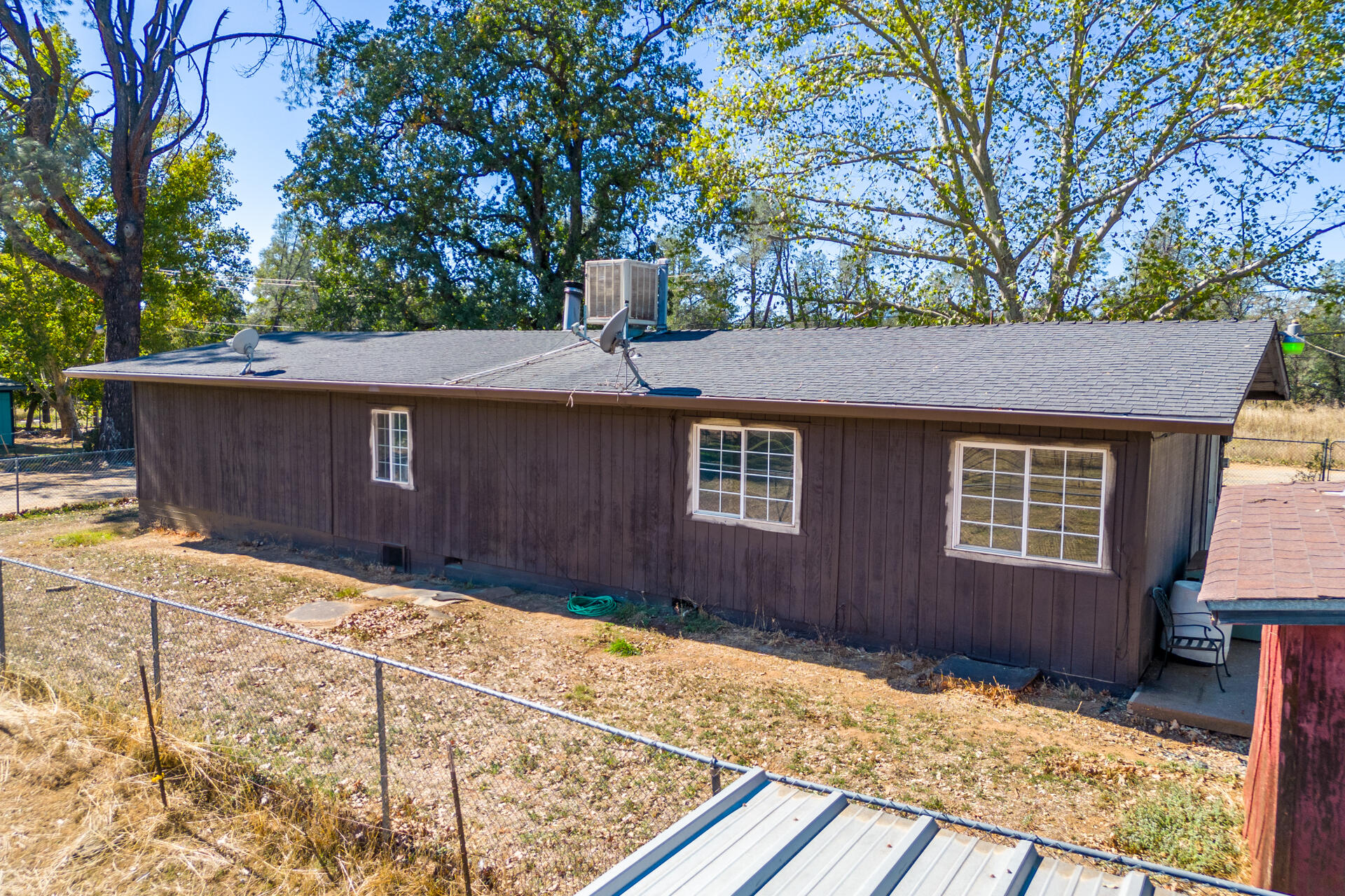 12141 Cinder Road Redding, CA 96003 - Photo 18 of 23 a house with trees in the background