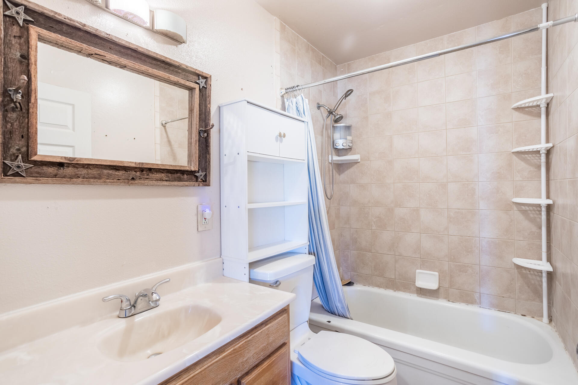 12141 Cinder Road Redding, CA 96003 - Photo 7 of 23 a bathroom with a sink toilet and shower