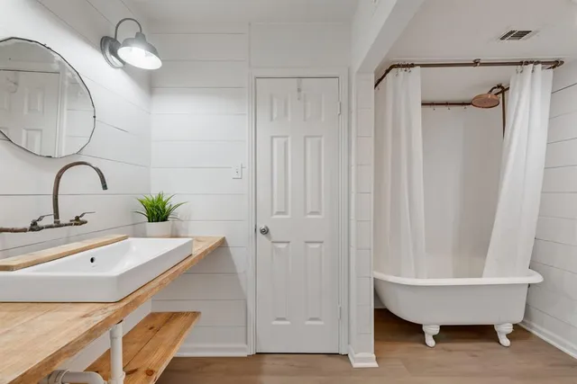 a bathroom with a sink and a mirror