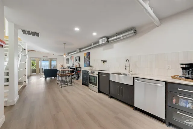 a kitchen with stainless steel appliances lots of counter top space