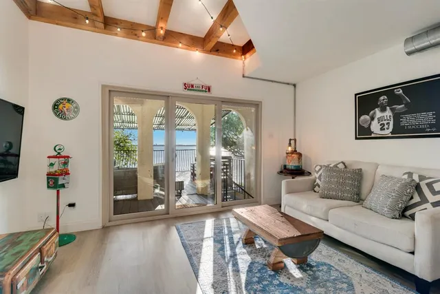 a living room with furniture and a large window