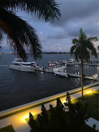 a view of a swimming pool with a table and chairs