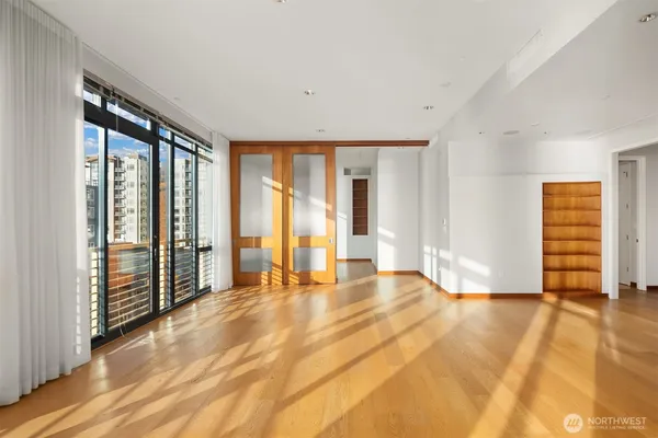 a view of an empty room with glass door