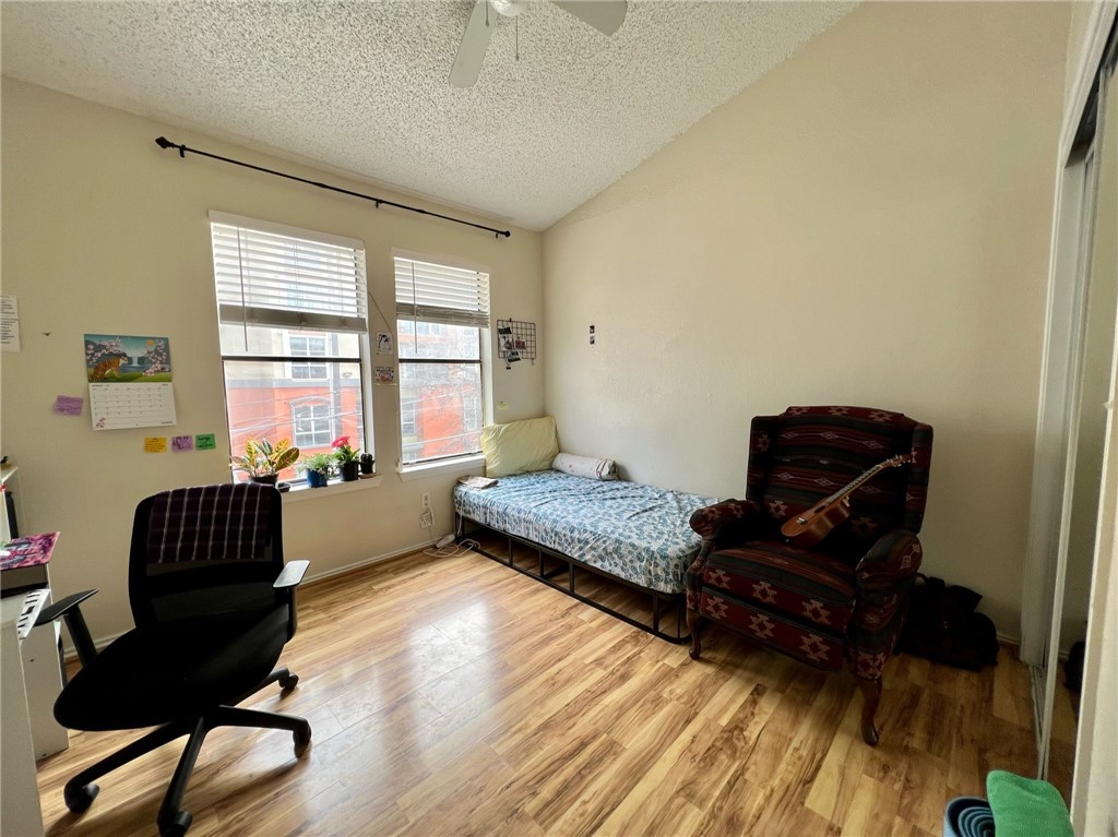 2706 Salado Street, Unit 302 Austin, TX 78705 - Photo 7 of 10 a bedroom with a bed and a window