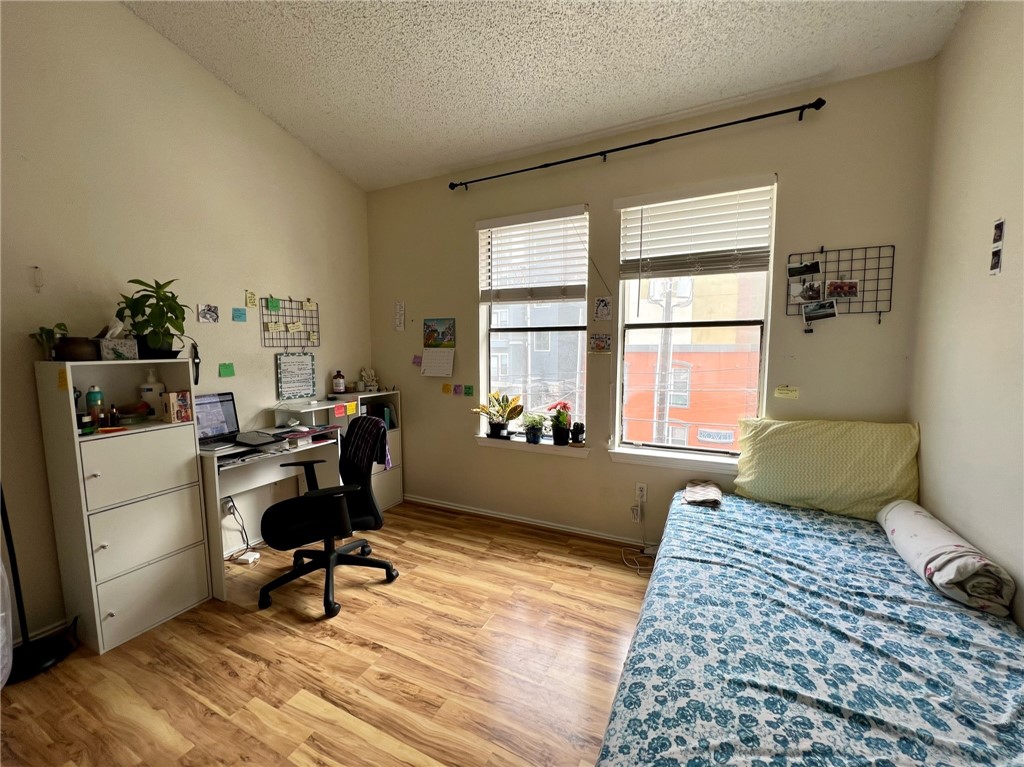 2706 Salado Street, Unit 302 Austin, TX 78705 - Photo 8 of 10 a bedroom with a workspace