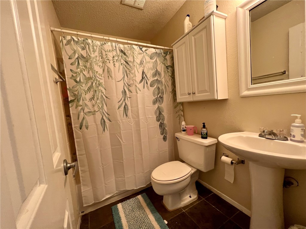 2706 Salado Street, Unit 302 Austin, TX 78705 - Photo 10 of 10 a bathroom with a sink and toilet