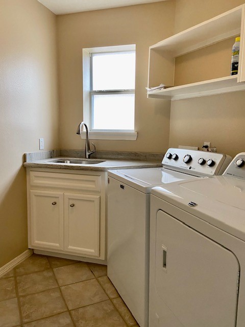 4916 Maxie Street Houston, TX 77007 - Photo 7 of 8 a utility room with dryer and washer
