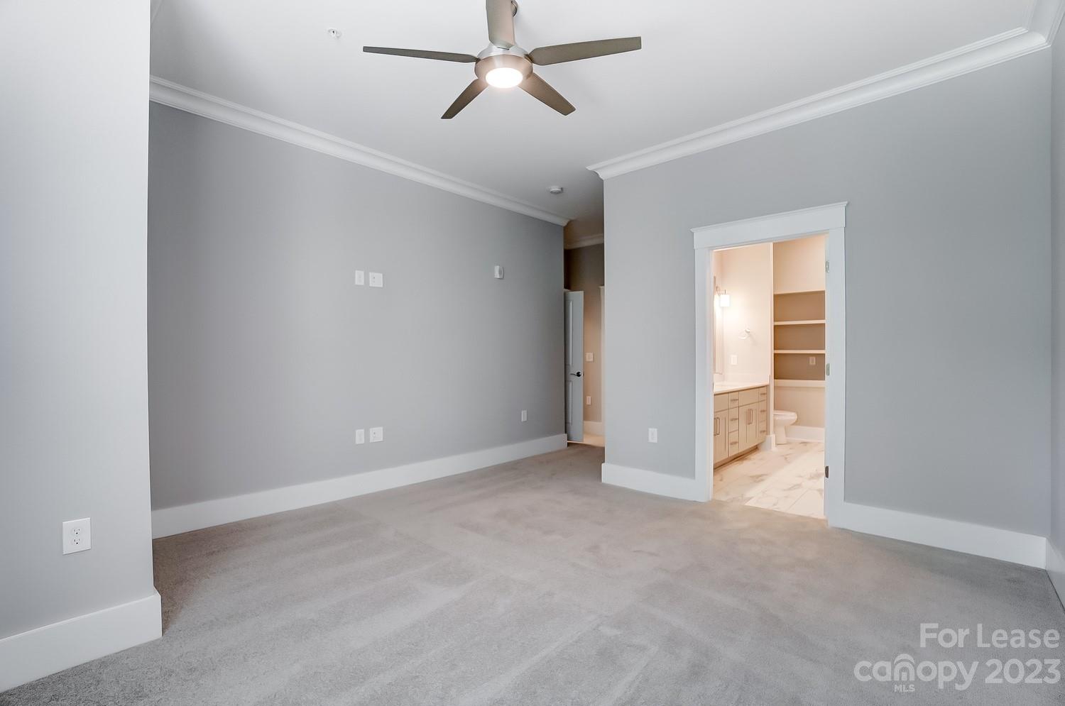 830 Providence Road, Unit 104 Charlotte, NC 28207 - Photo 12 of 21 a view of an empty room with a window