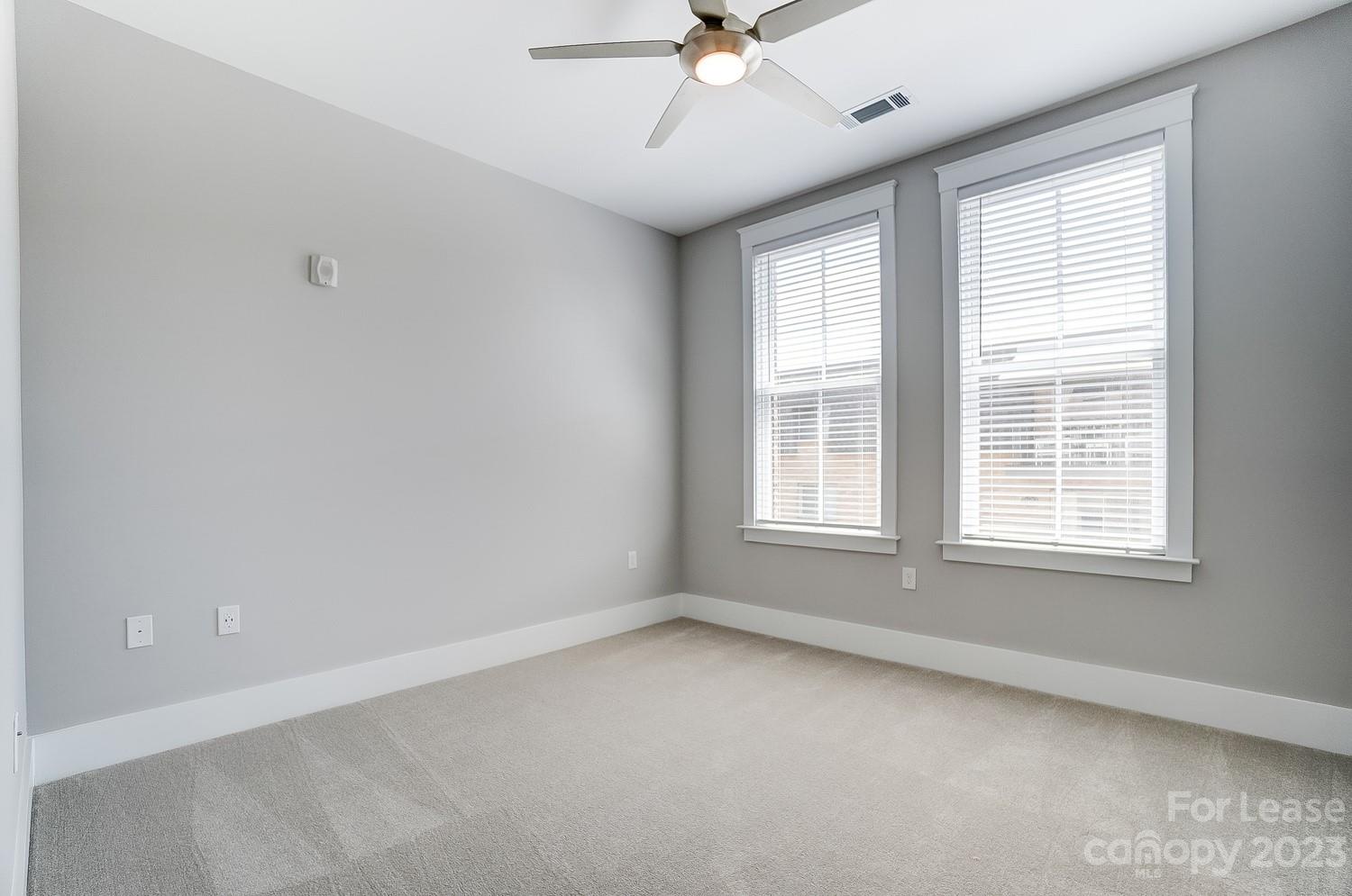 830 Providence Road, Unit 104 Charlotte, NC 28207 - Photo 18 of 21 an empty room with a window
