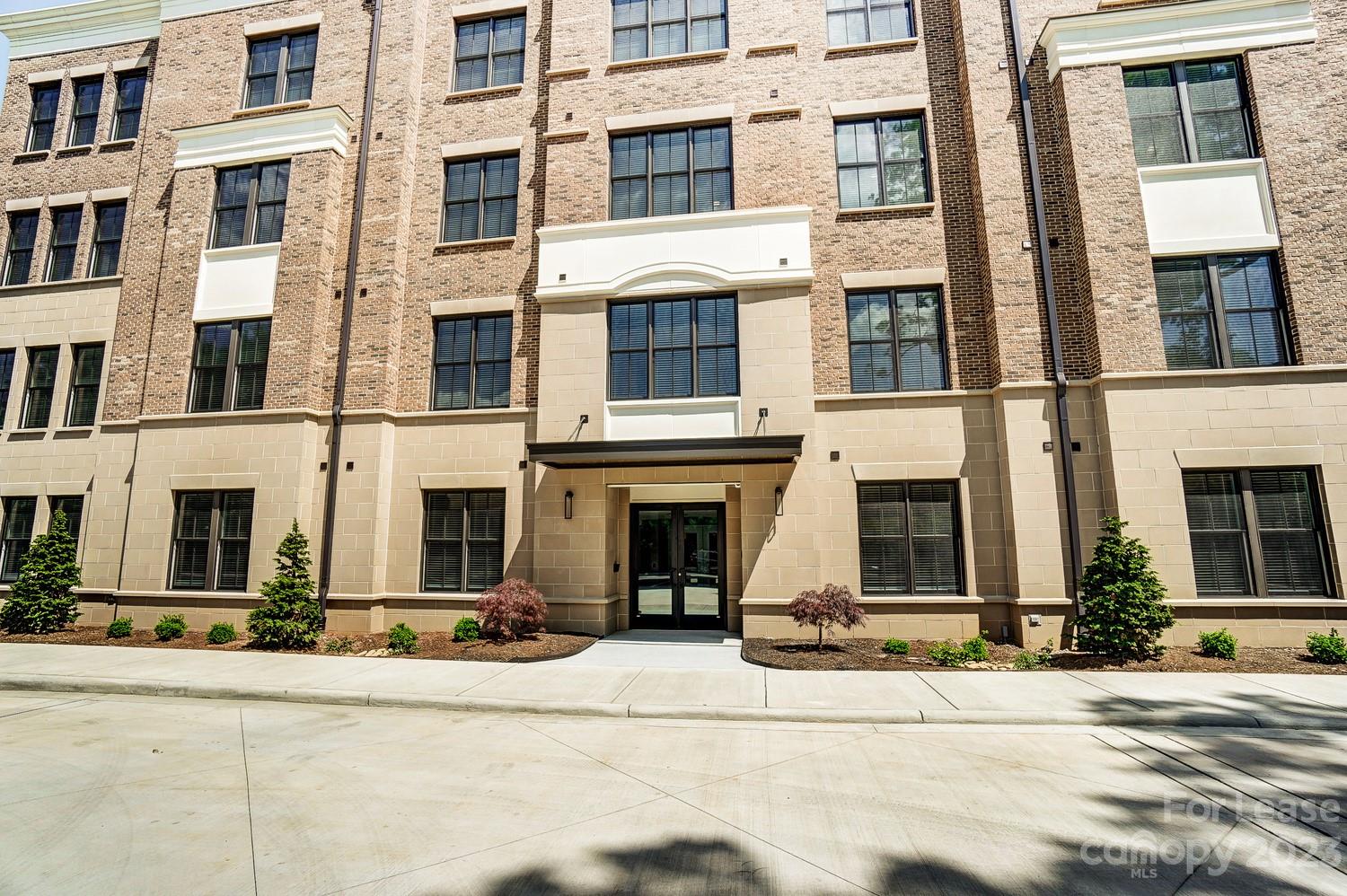 830 Providence Road, Unit 104 Charlotte, NC 28207 - Photo 2 of 21 a view of a building with a street