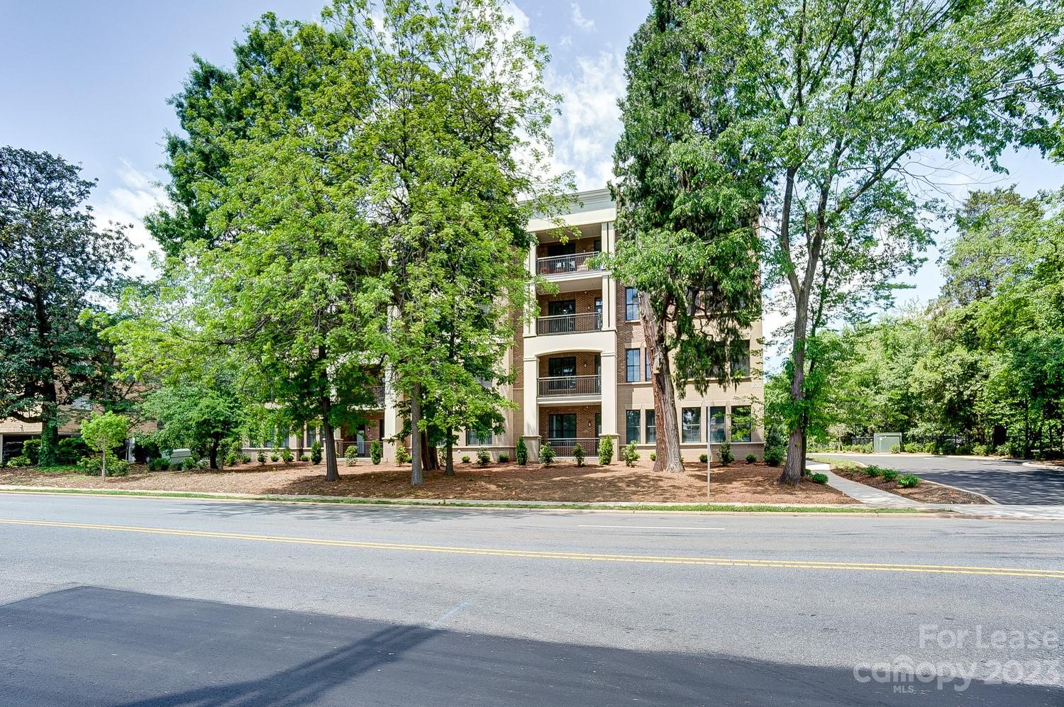 830 Providence Road, Unit 104 Charlotte, NC 28207 - Photo 3 of 21 front view of a building with a street
