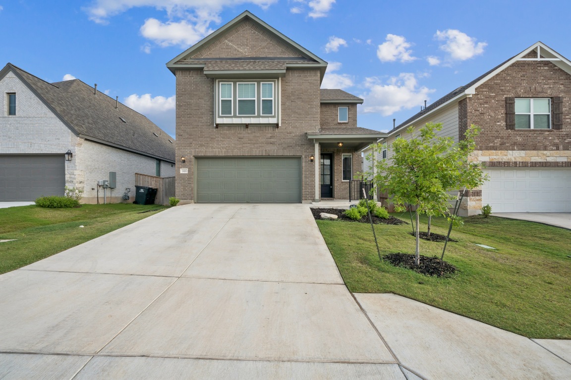 321 Kays Path Georgetown, TX 78626 - Photo 1 of 1 a front view of a house with a yard
