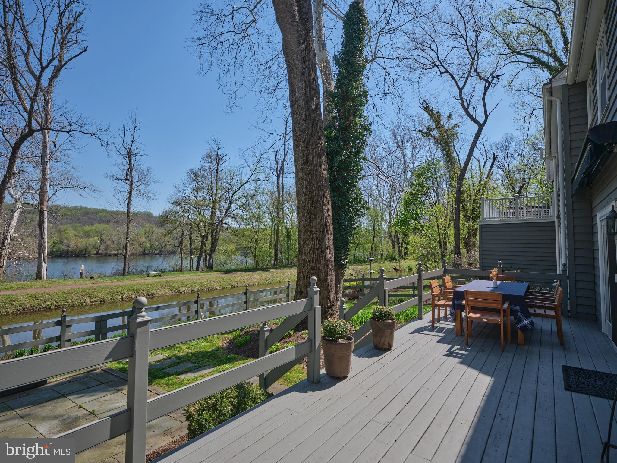 2976 River Road New Hope, PA 18938 - Photo 26 of 37 a view of deck with table and chairs and wooden floor