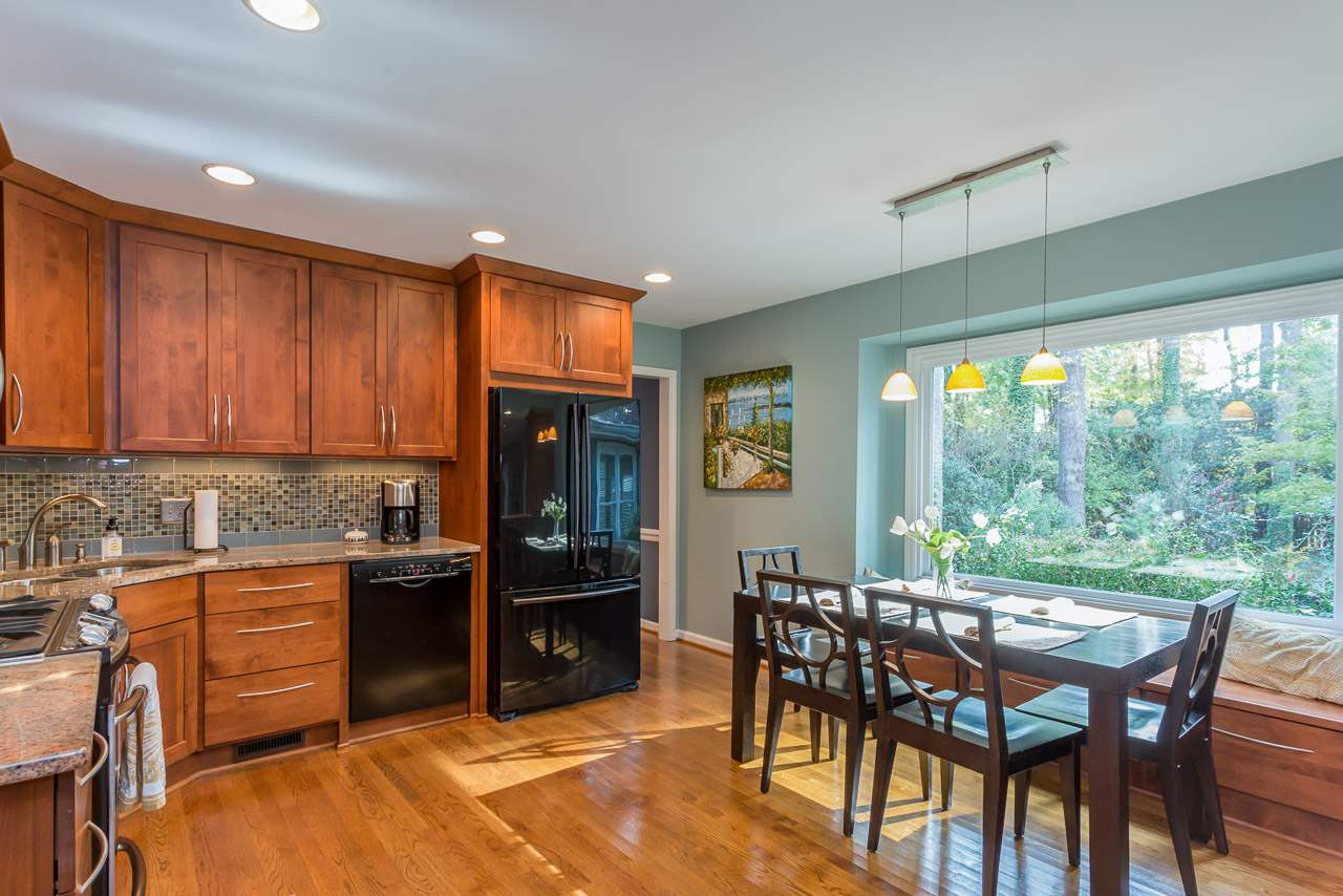 7608 Harps Mill Road Raleigh, NC 27615 - Photo 7 of 25 The updated kitchen offers both recessed lighting and under cabinet lighting which causes the tile back splash to sparkle. Updated Kitchen Lighting