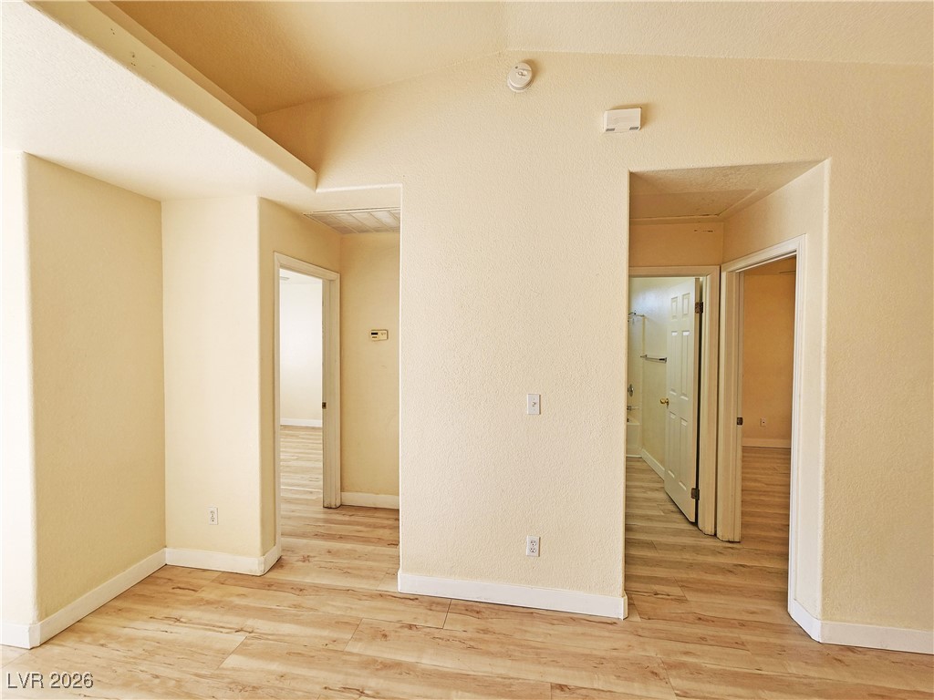 1081 Marne Court, Unit C Pahrump, NV 89048 - Photo 12 of 22 Empty room featuring light wood-style flooring and baseboards