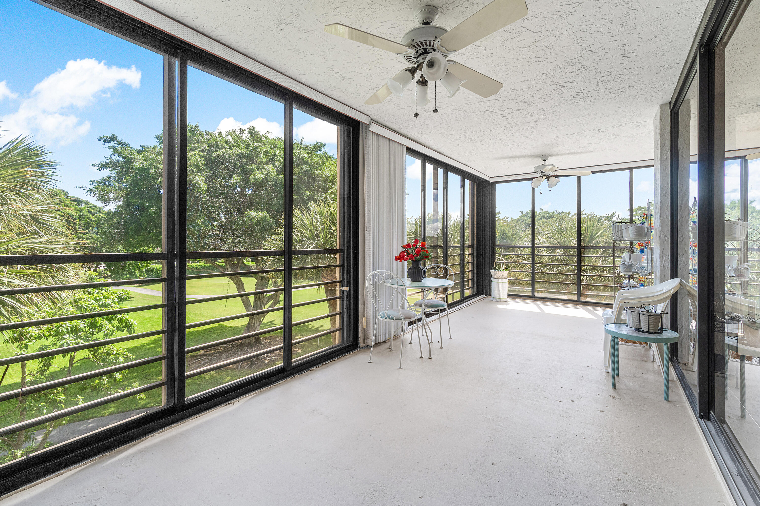 7572 Regency Lake Drive, Unit 401 Boca Raton, FL 33433 - Photo 11 of 28 a view of an entryway with a floor to ceiling window
