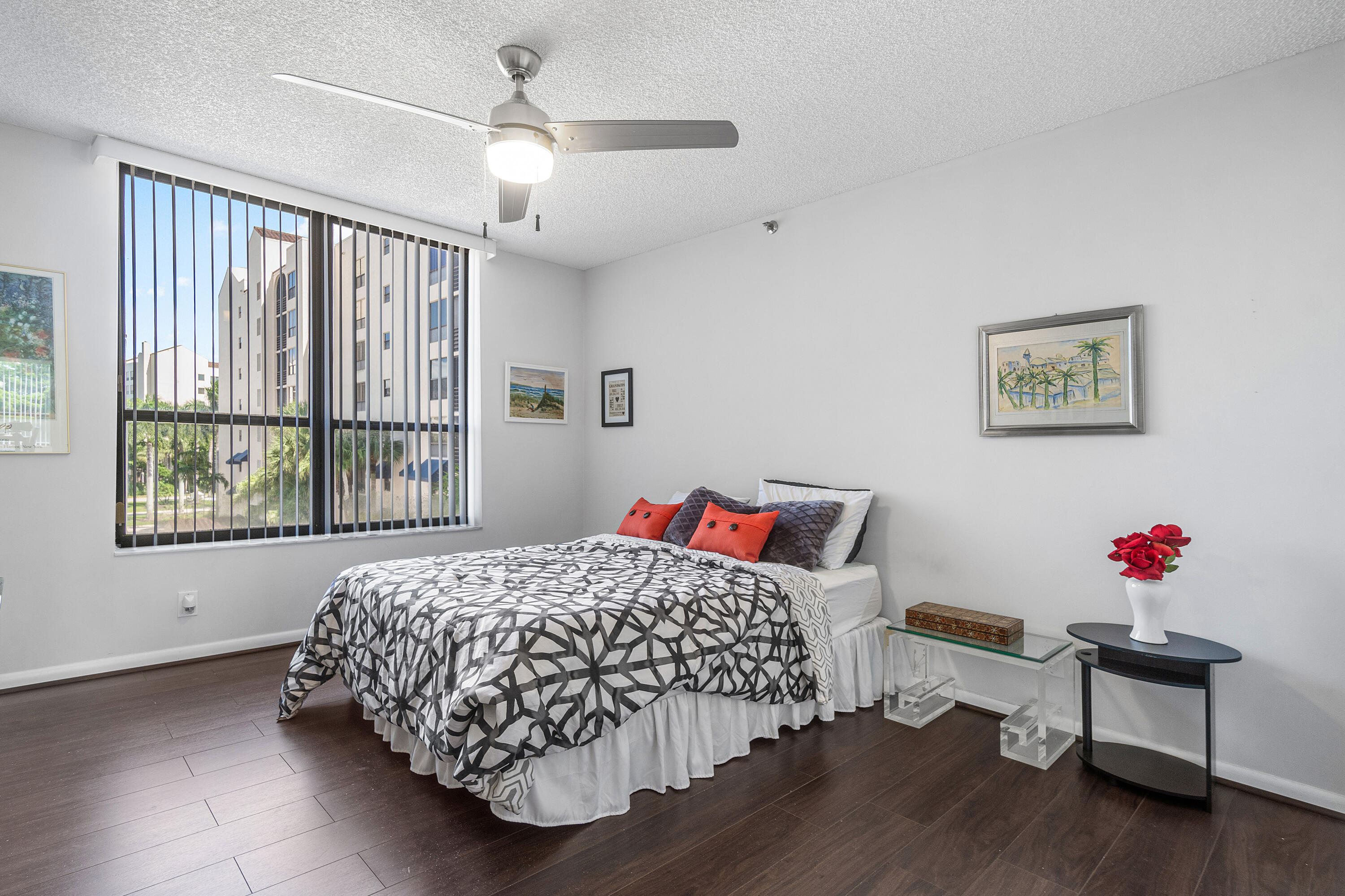 7572 Regency Lake Drive, Unit 401 Boca Raton, FL 33433 - Photo 19 of 28 a bedroom with a bed and a window