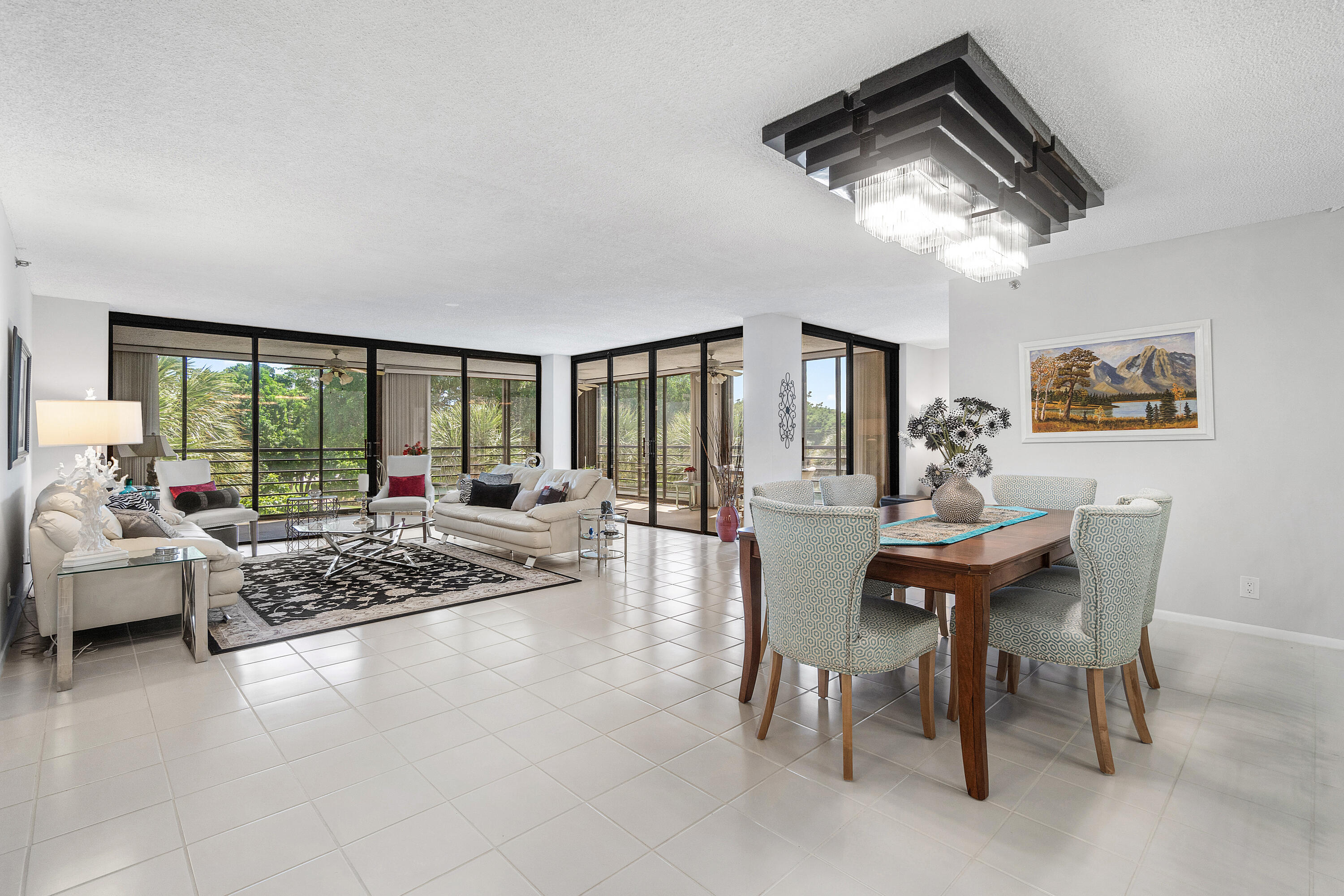 7572 Regency Lake Drive, Unit 401 Boca Raton, FL 33433 - Photo 4 of 28 a view of a livingroom with furniture and floor to ceiling window
