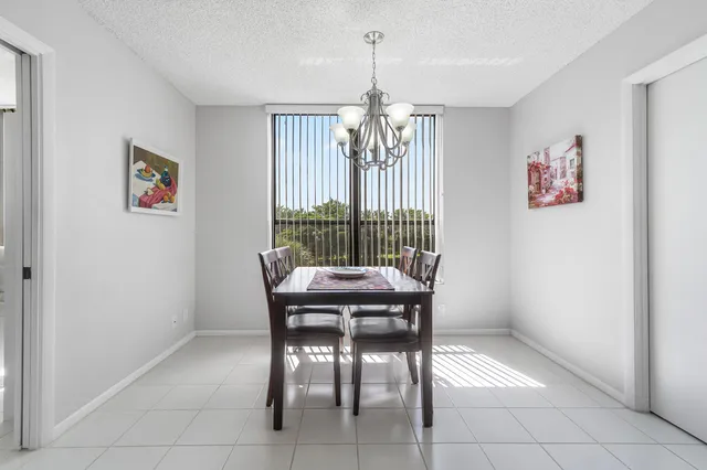 a view of a dining room with furniture window and chandelier