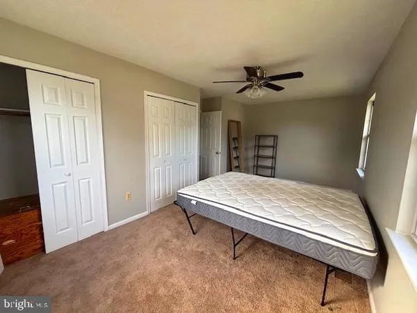 a room with a bed and a chandelier