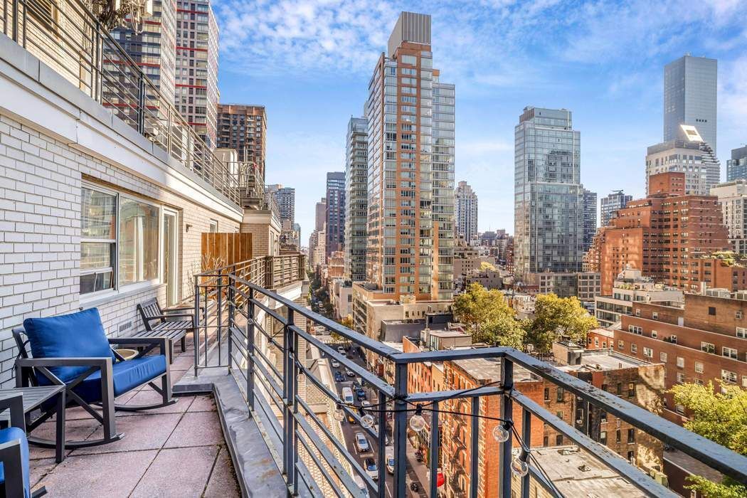 a view of city with tall buildings