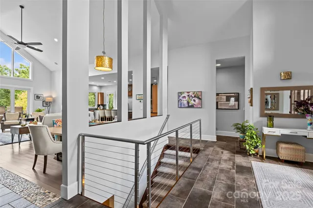 a view of a dining room with furniture and a window