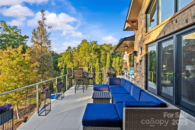 a view of a balcony with chairs