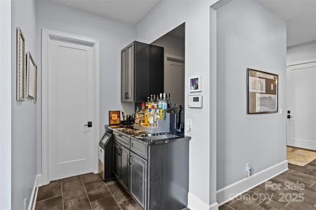 a kitchen with stainless steel appliances granite countertop a refrigerator and a stove