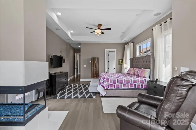 a bathroom with a tub double vanity sink and a mirror