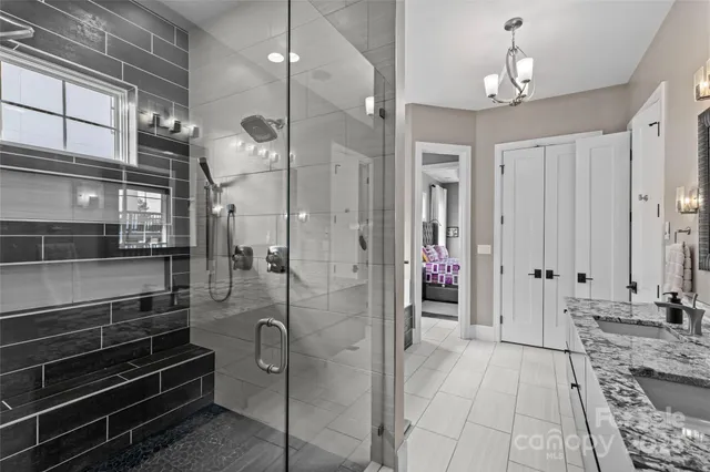 a utility room with sink dryer and washer