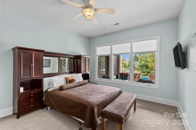 a bathroom with a granite countertop sink a toilet and shower