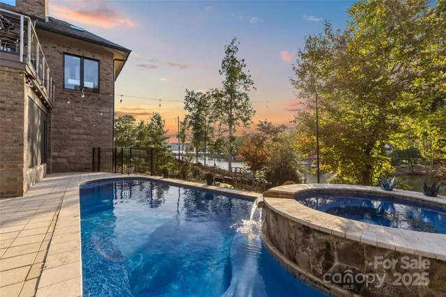 a swimming pool with view of lake