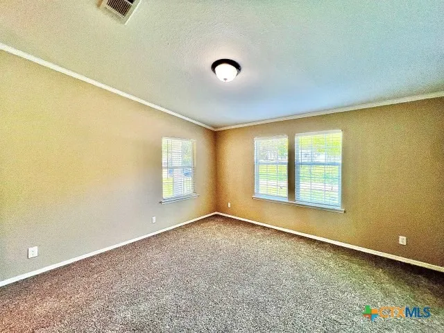 an empty room with a empty space and a window