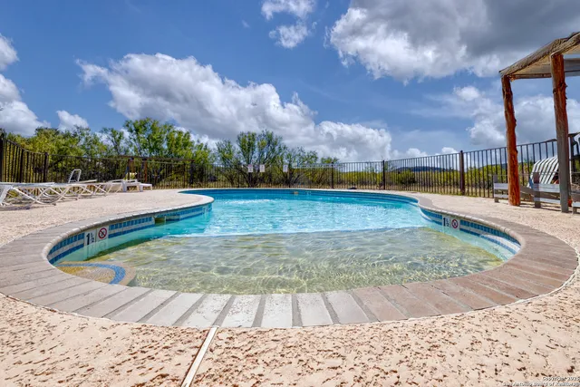 a view of a swimming pool with an outdoor space