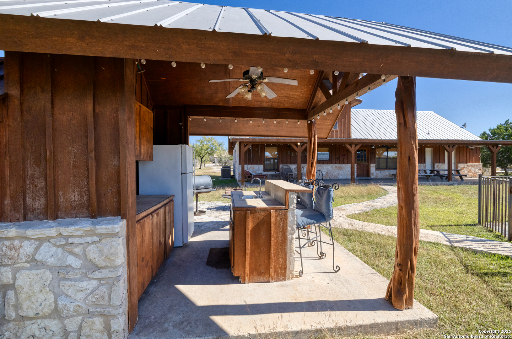 38 Mountain Laurel Lane Concan, TX 78838 - Photo 17 of 48 a view of a living room and kitchen