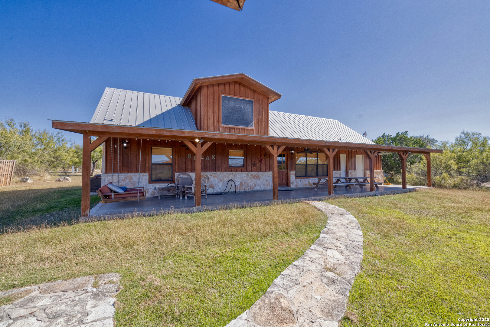 38 Mountain Laurel Lane Concan, TX 78838 - Photo 18 of 48 a view of a house with swimming pool and porch