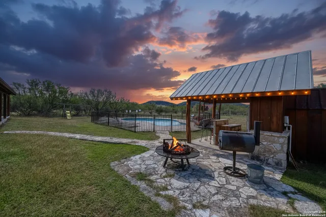 a view of a patio with chair and tables